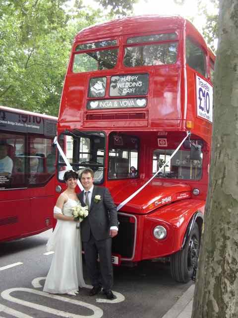 The Bride & Groom posing in front of RM 848, after a morning Wedding ceremony in east London.
